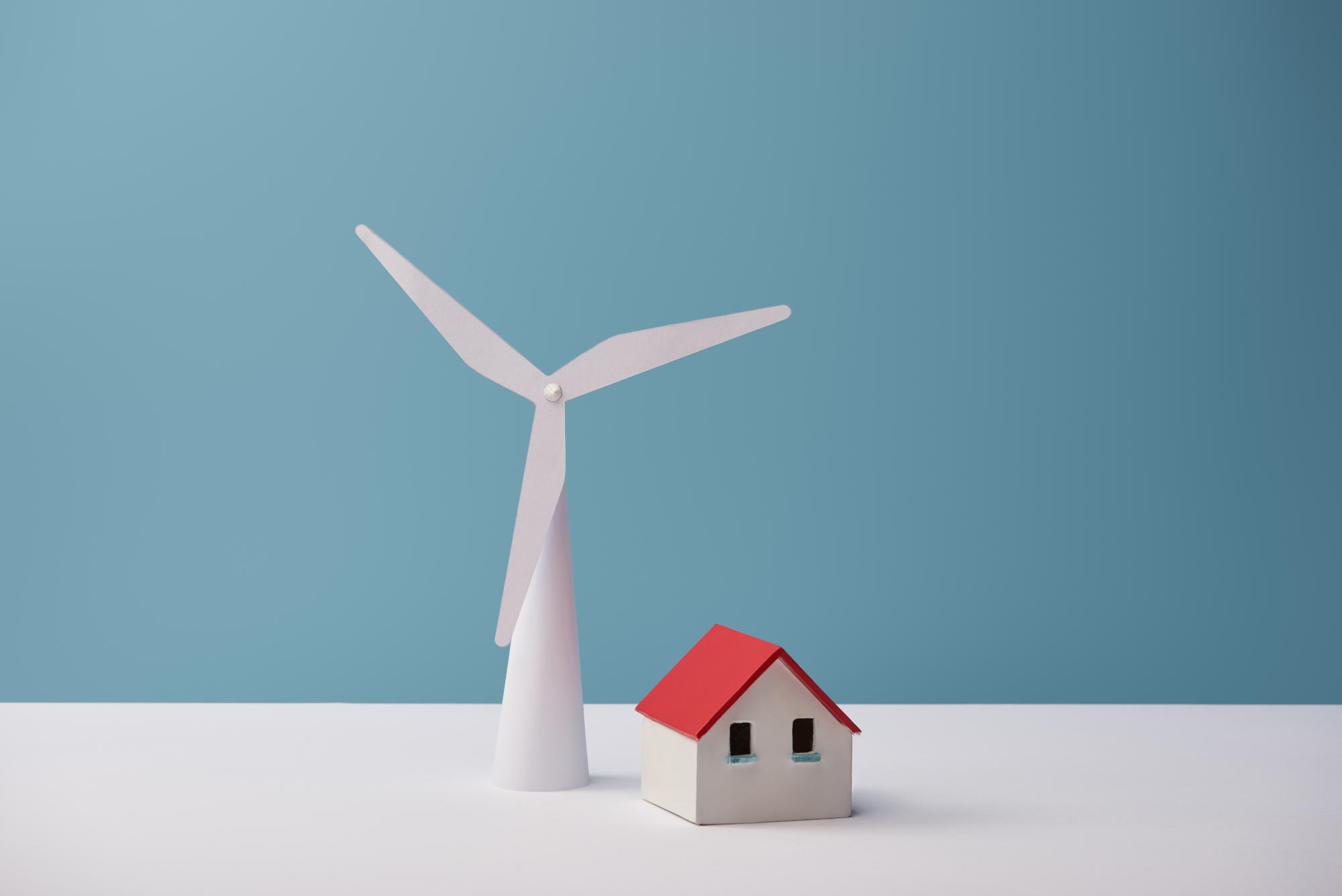 windmill and house models on white table and blue 2024 11 10 03 37 17 utc